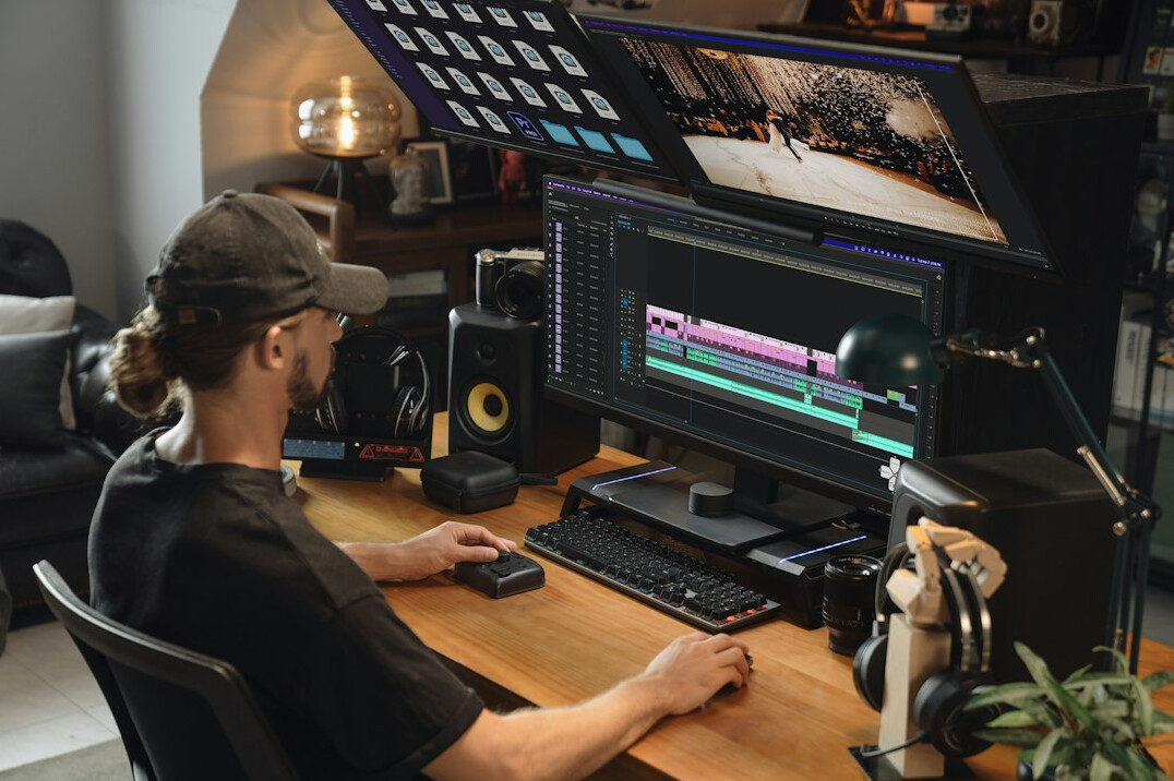 person editing video on computer